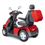 Left View Of Mobility Scooter In Red With Standard Wheels And Lock Box On Rear. Left View Of Mobility Scooter In Red With Standard Wheels And Lock Box On Rear.
