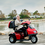 Outdoor View Of 3 Wheel Scooter In Red With Optional Golf Tires. Outdoor View Of 3 Wheel Scooter In Red With Optional Golf Tires.