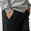 Side view of standing model with hands in pockets